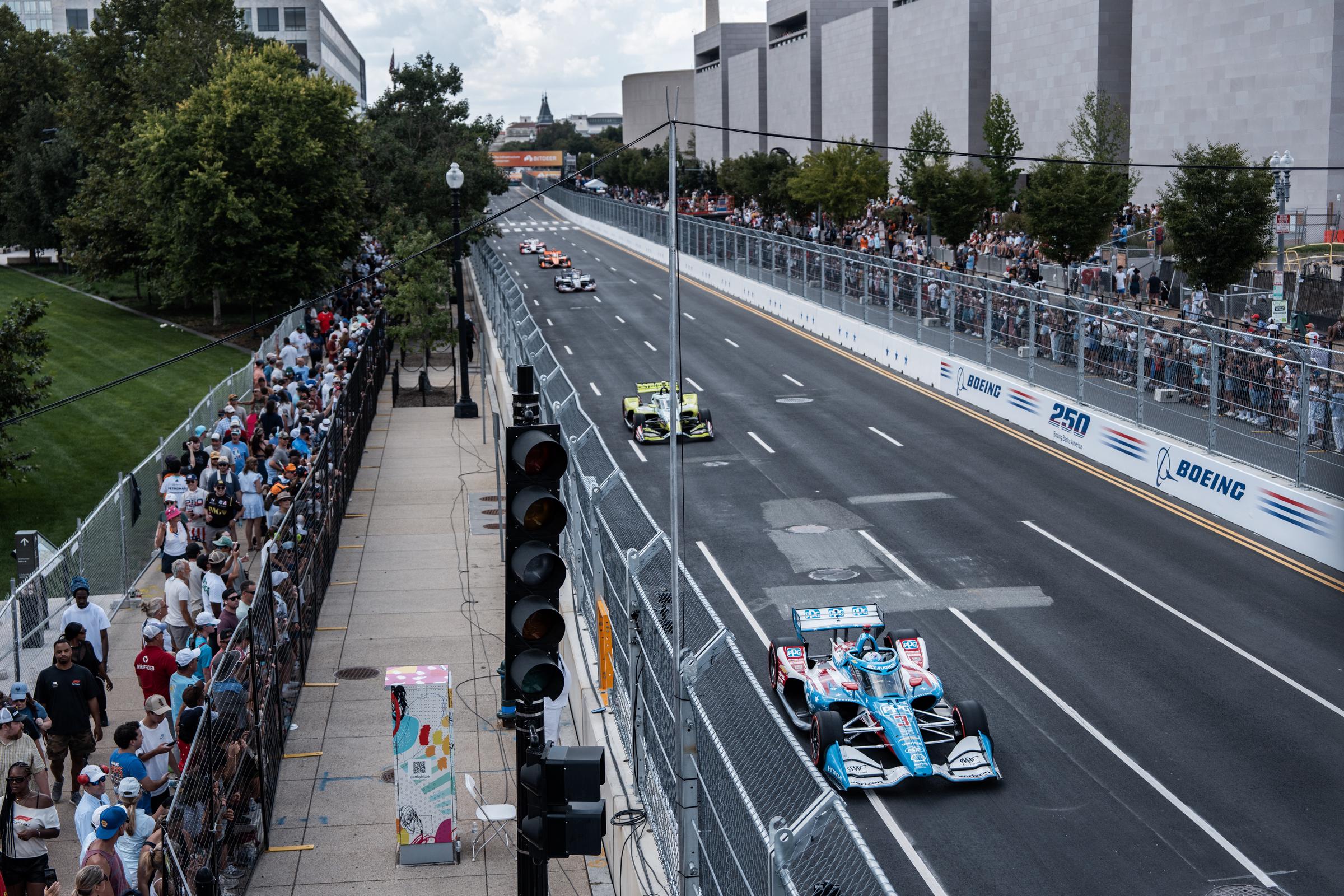 The president and first lady attended the high-profile event. In this photo, cars raced along Independence Avenue during