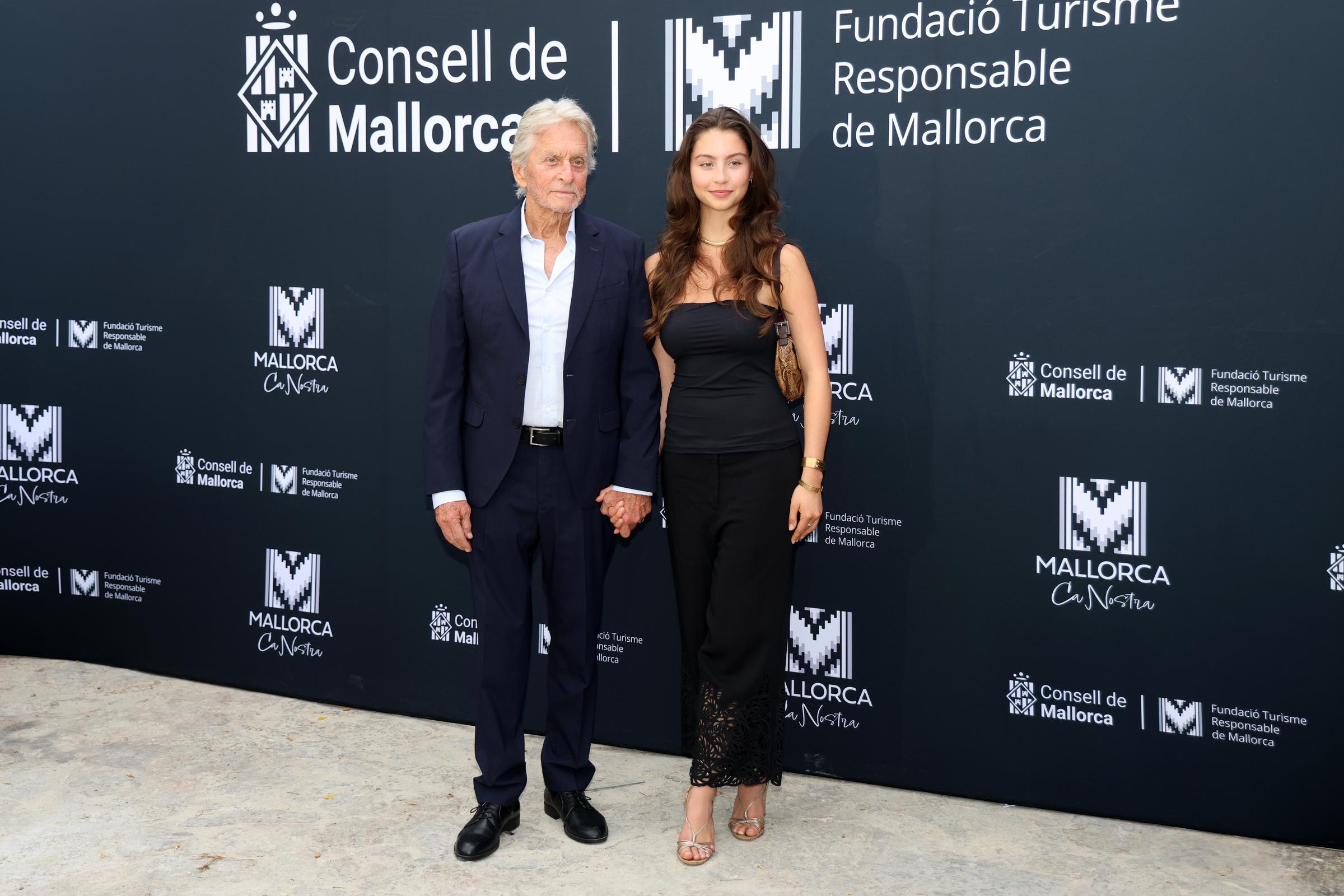Michael Douglas and Carys Douglas' rare appearance together fueled a wave of reactions, with fans split over whether the