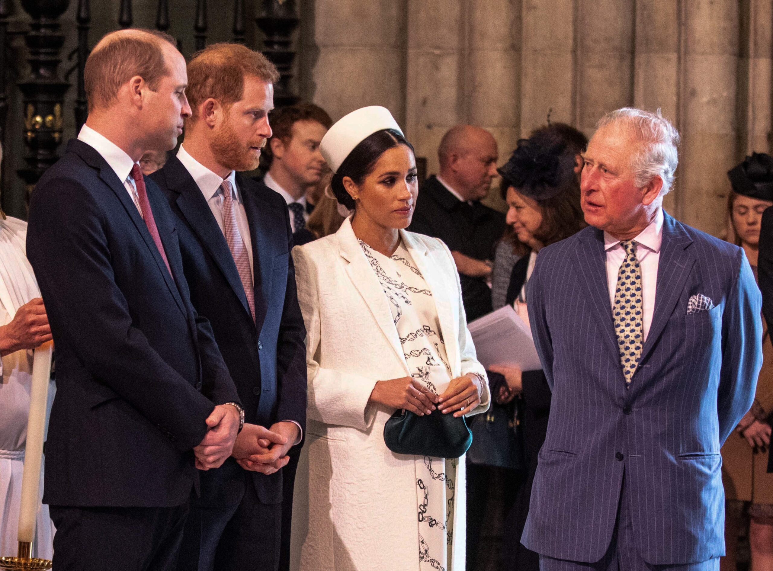 Prince William, Prince Harry, Meghan Markle, Duchess of Sussex, talk with King Charles III as they attend the Commonweal