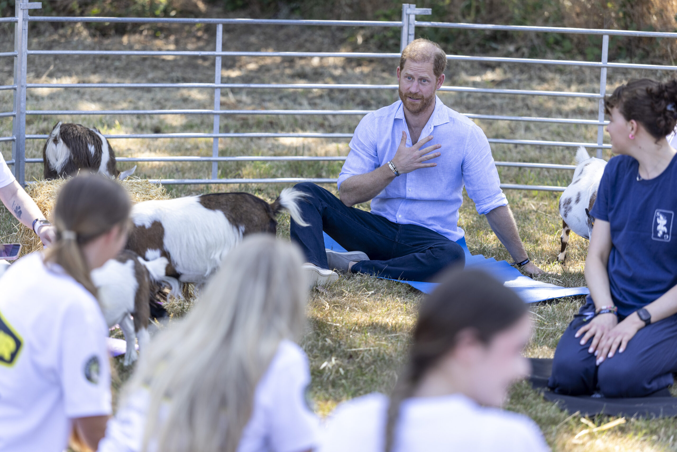 Prince Harry went alone to several events this week. As seen in this photo, he took part in goat yoga during Scotty's Su
